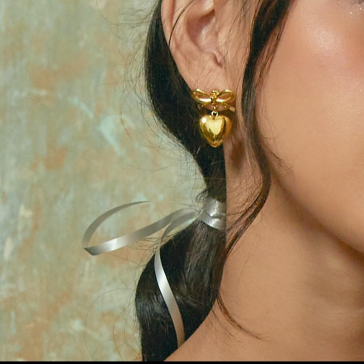 Bow drop heart earnings
