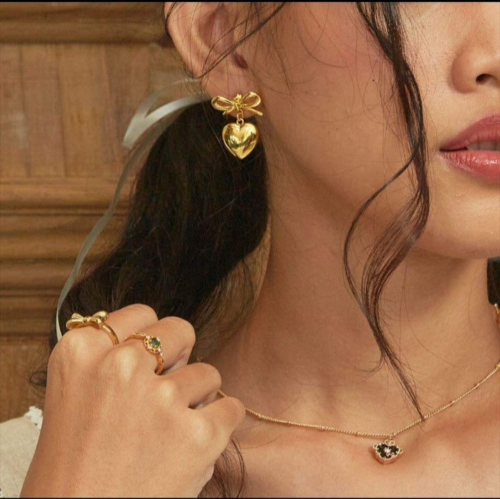 Bow drop heart earnings